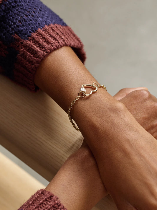 Image of Bracelets. Product name - Baguette Baby Heart Lock + Pulley Chain 14-karat Gold Diamond Bracelet in Multi colour by brand - Marla Aaron