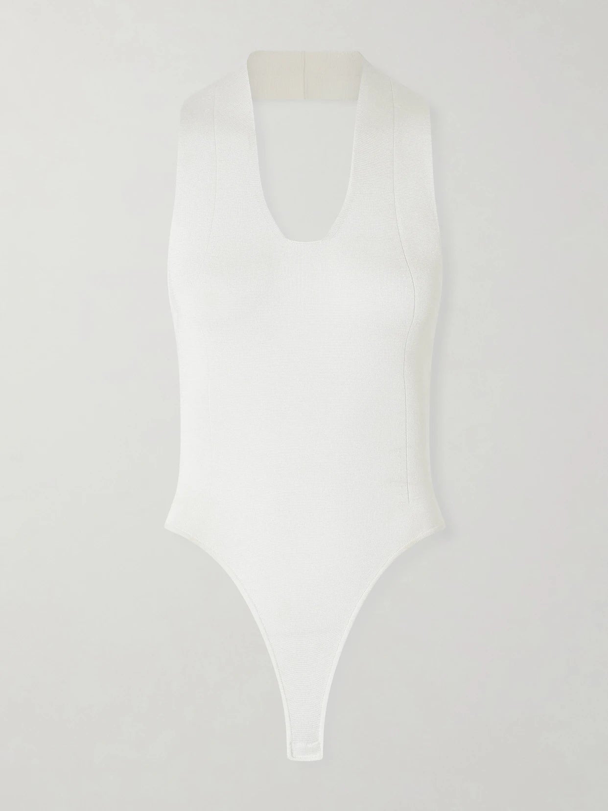 Image of a model wearing Tops. Product name - Toto Stretch-knit Halterneck Bodysuit in White colour by brand - KHAITE