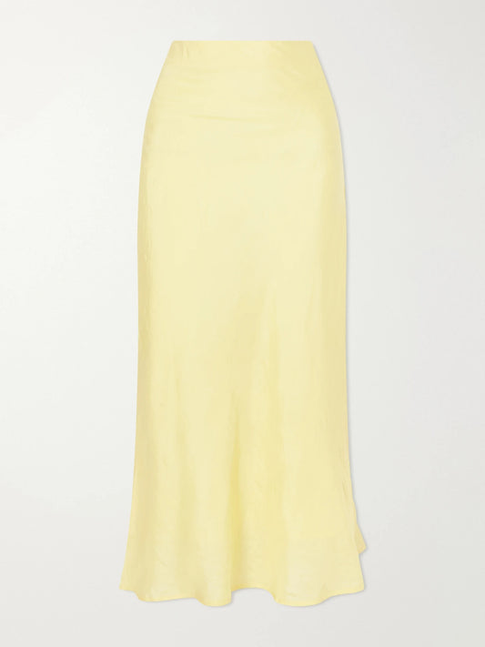 Image of a model wearing Skirts. Product name - Lyra Sunlight Silk Midi Skirt in Pastel yellow colour by brand - ALIX OF BOHEMIA
