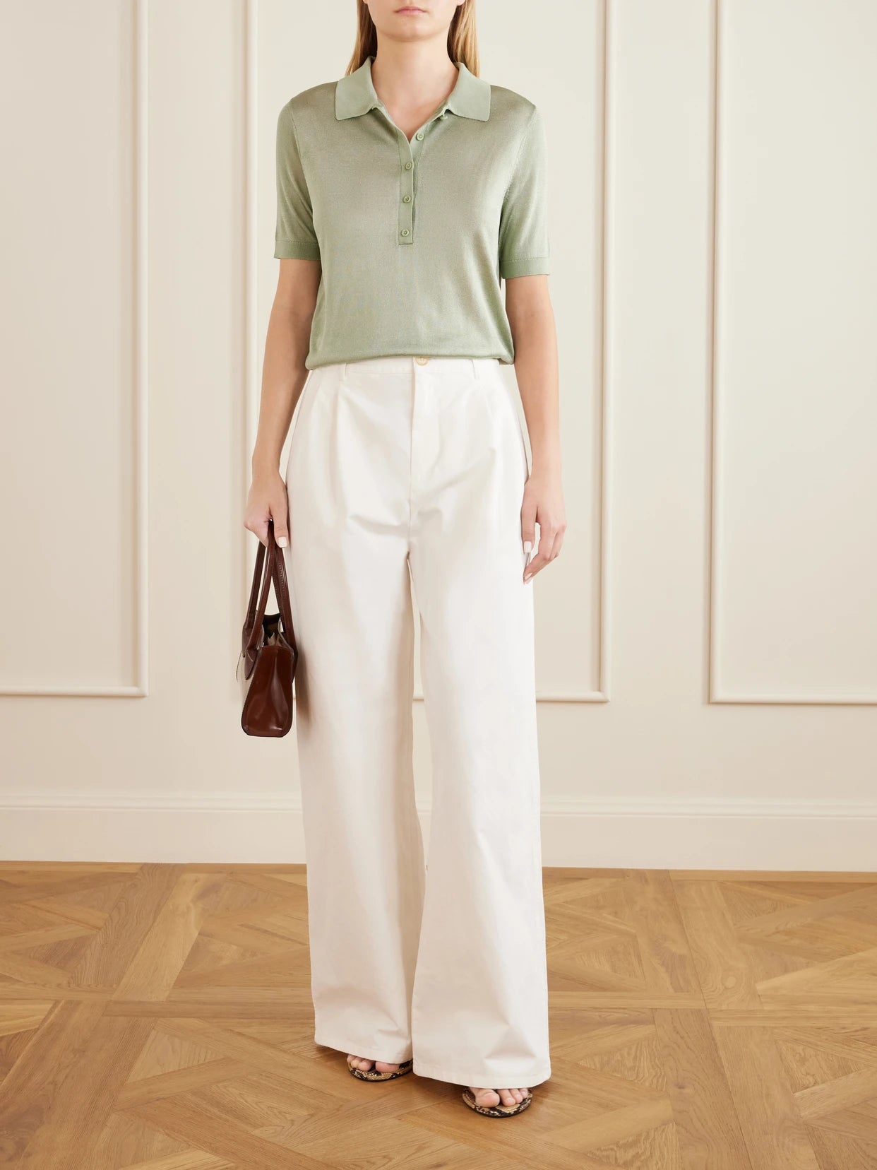 Image of a model wearing Tops. Product name - Piqué Polo T-shirt in Green colour by brand - Theory