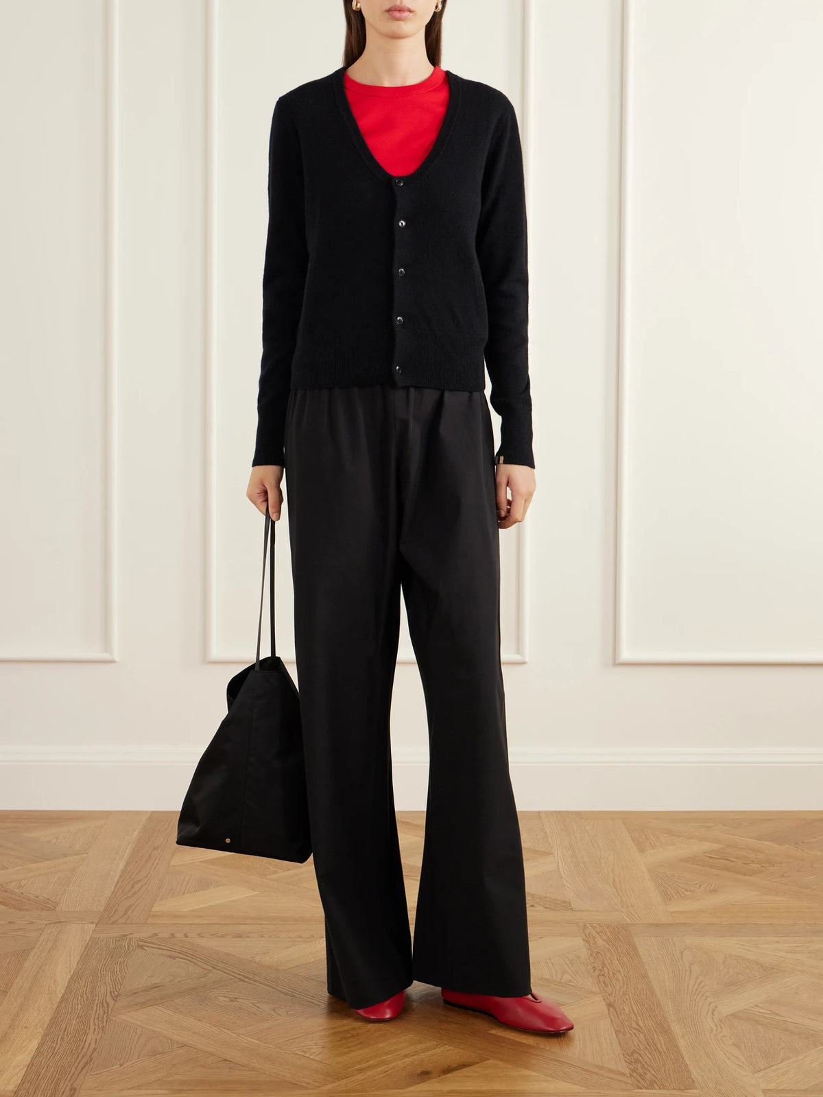 Image of a model wearing Outerwear. Product name - Dorothea Cashmere-knitted Cardigan in Black colour by brand - Extreme Cashmere