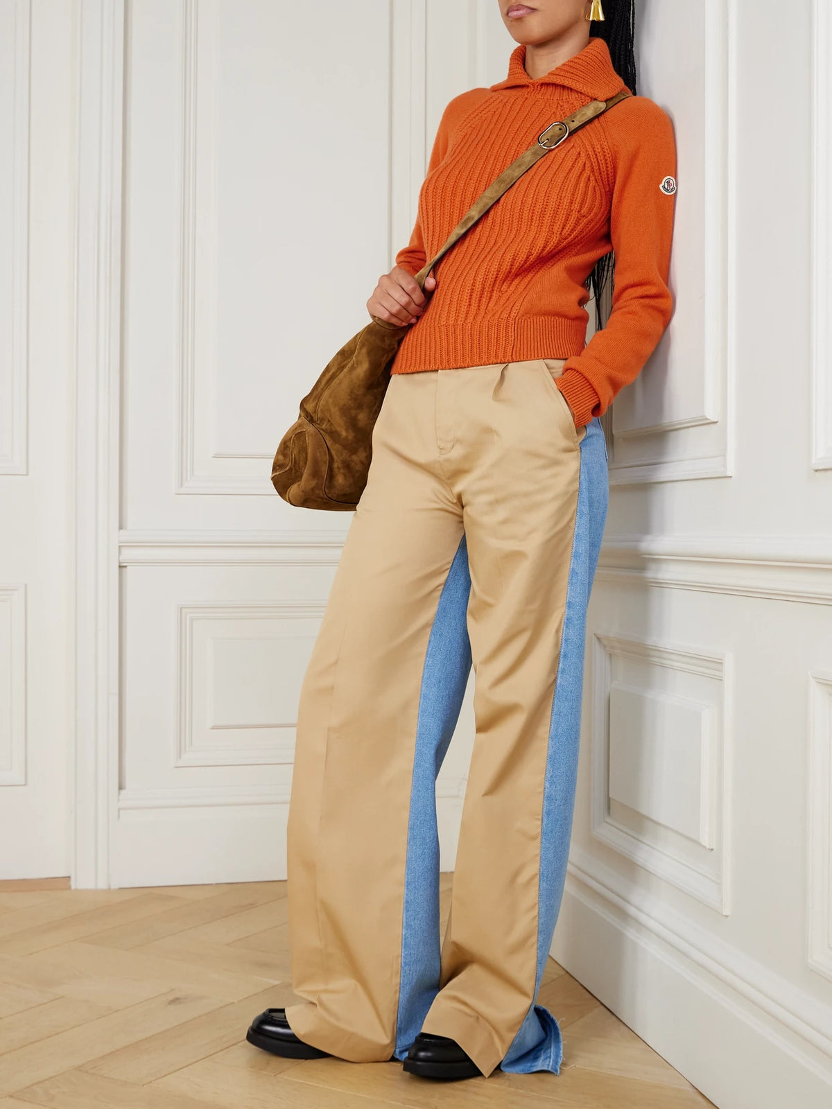 Image of a model wearing Outerwear. Product name - Ribbed Wool And Cashmere-blend Turtleneck Polo Sweater in Orange colour by brand - Moncler