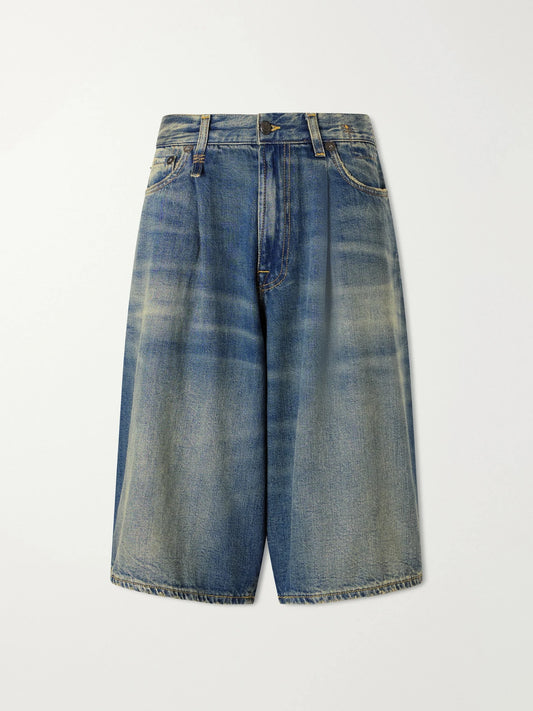 Image of a model wearing Shorts. Product name - Jesse Denim Shorts in Mid denim colour by brand - R13