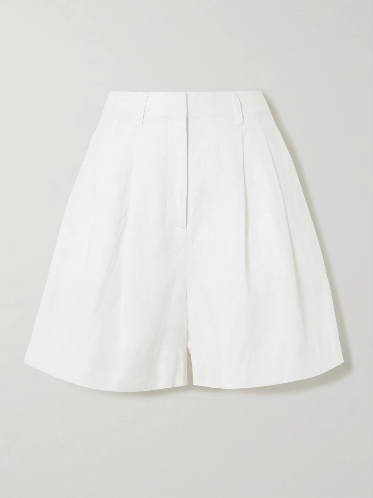 Image of a model wearing Shorts. Product name - Marchello Pleated Linen Shorts in Ivory colour by brand - Posse