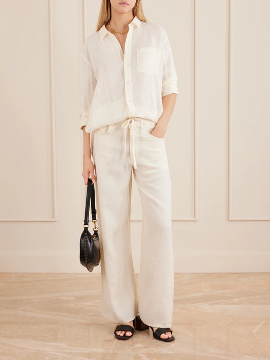 Image of a model wearing Pants. Product name - Brynn Linen Straight-leg Pants in Cream colour by brand - Citizens of Humanity