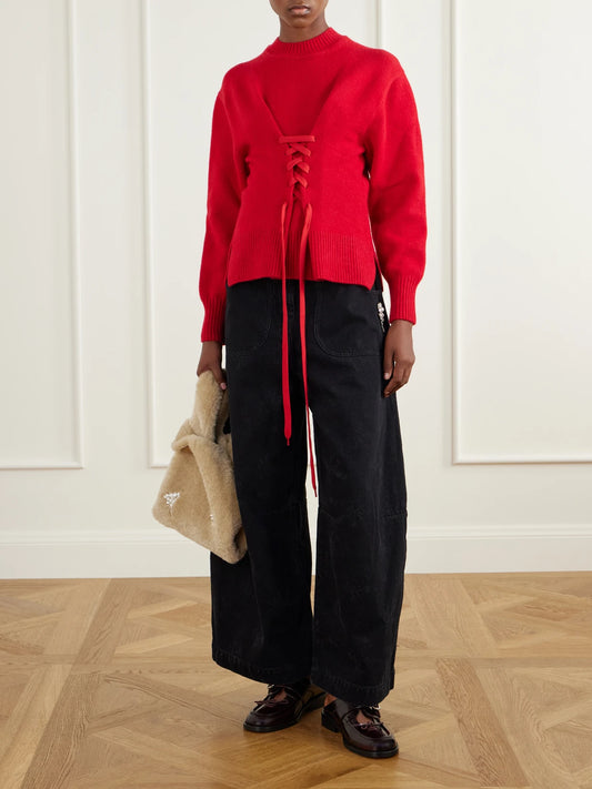 Image of a model wearing Outerwear. Product name - Merino Wool-blend Sweater in Red colour by brand - Simone Rocha
