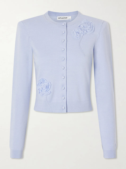 Image of a model wearing Outerwear. Product name - Appliquéd Knitted Cardigan in Blue colour by brand - Self-Portrait