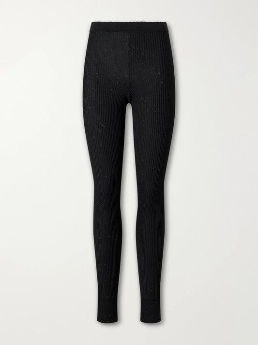 Image of a model wearing Pants. Product name - Ribbed Lurex Leggings in Black colour by brand - TOM FORD