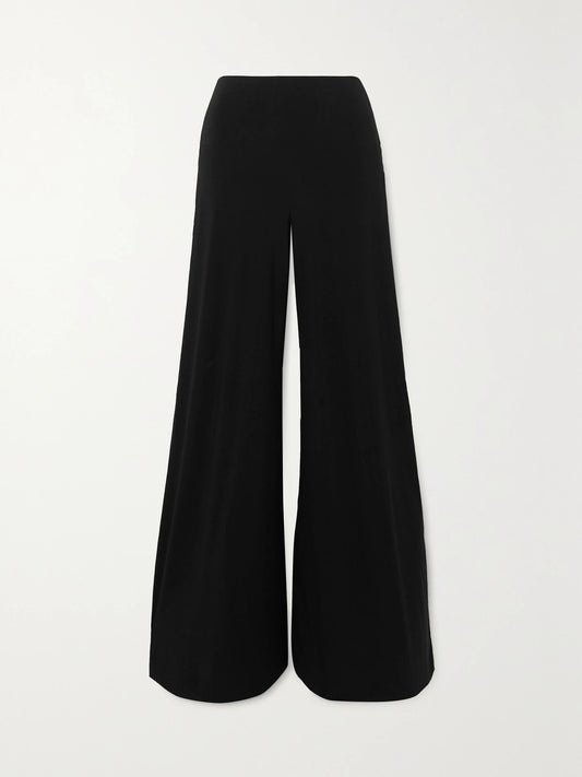 Image of a model wearing Pants. Product name - Elephant Stretch-jersey Wide-leg Pants in Black colour by brand - Norma Kamali