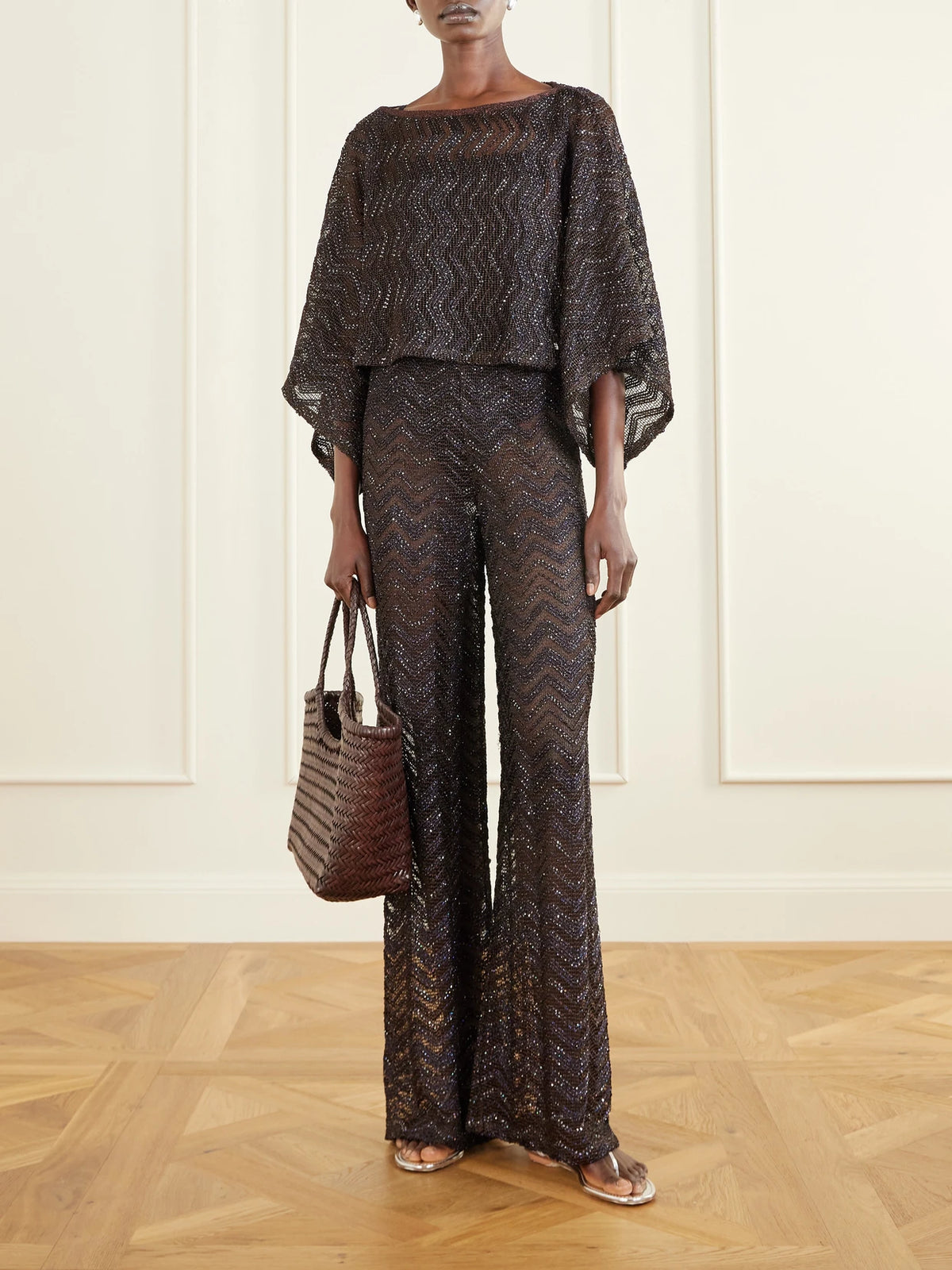Image of a model wearing Pants. Product name - Sequin-embellished Crochet-knit Wide-leg Pants in Brown colour by brand - Missoni
