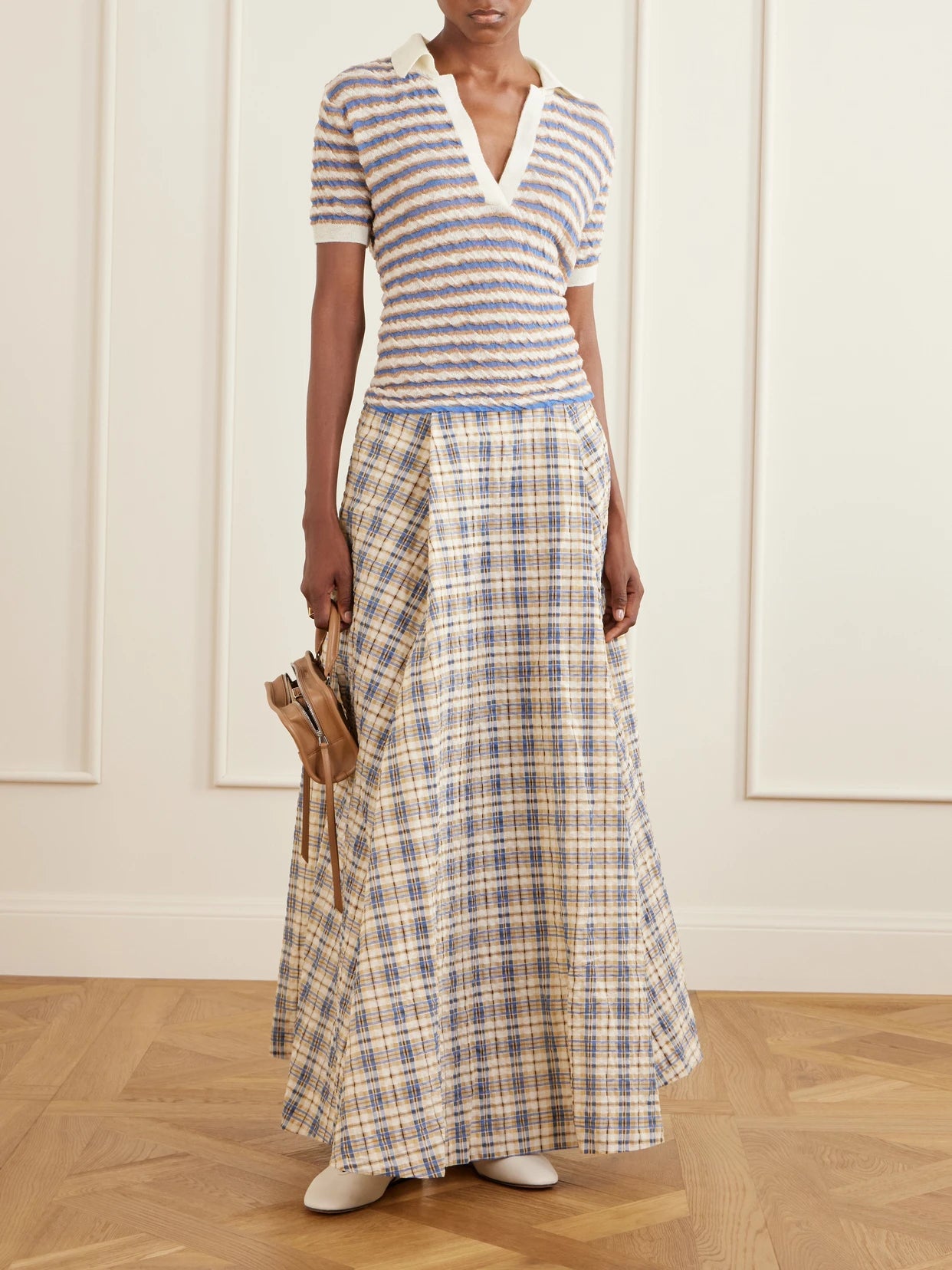Image of a model wearing Skirts. Product name - Checked Seersucker Maxi Skirt in Beige colour by brand - BERNADETTE