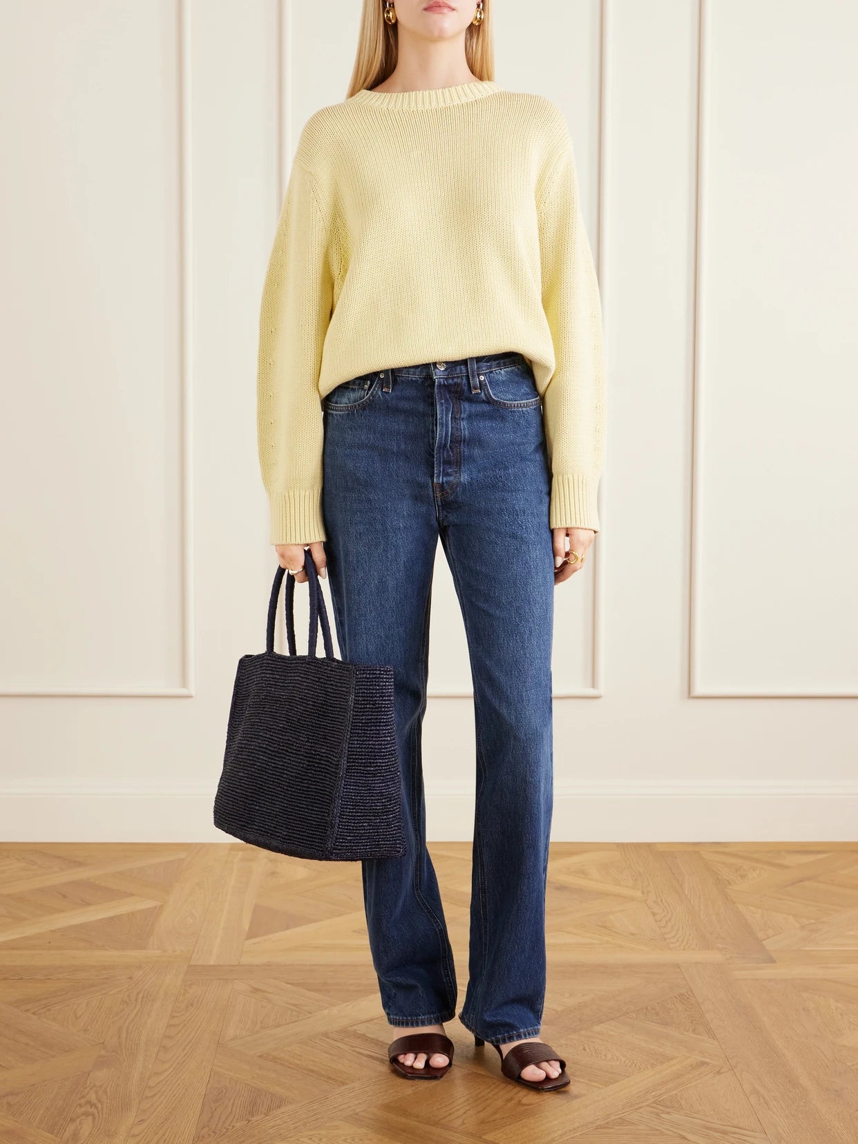 Image of a model wearing Outerwear. Product name - Oversized Organic Cotton-blend Sweater in Pastel yellow colour by brand - TOTEME