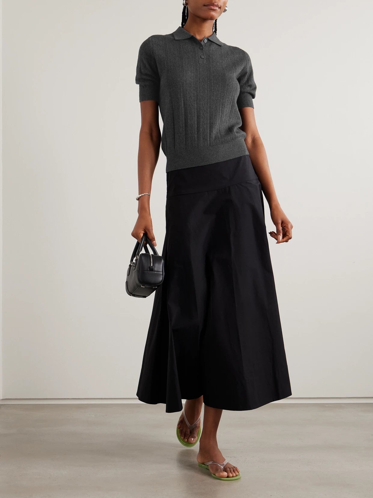 Image of a model wearing Outerwear. Product name - Cristine Pointelle-knit Cotton And Cashmere-blend Polo Shirt in Charcoal colour by brand - LISA YANG