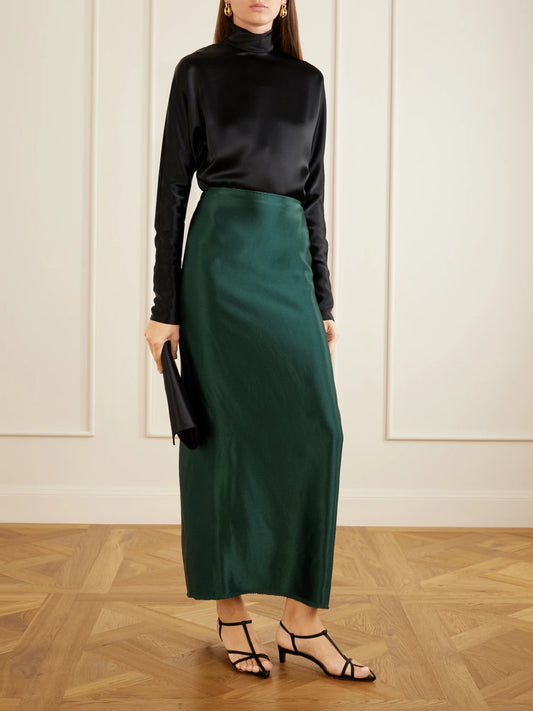 Image of a model wearing Skirts. Product name - Jovie Crepe-satin Midi Skirt in Forest green colour by brand - FFORME