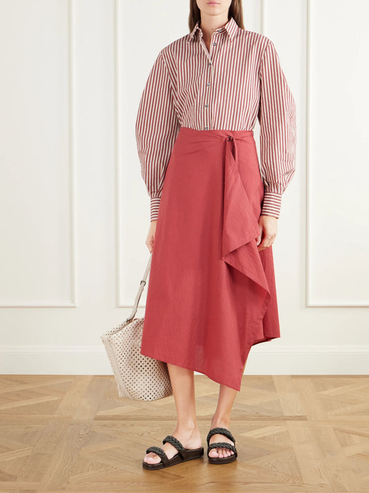 Image of a model wearing Skirts. Product name - Wrap-effect Ruffled Asymmetric Cotton-blend Poplin Midi Skirt in Red colour by brand - Brunello Cucinelli