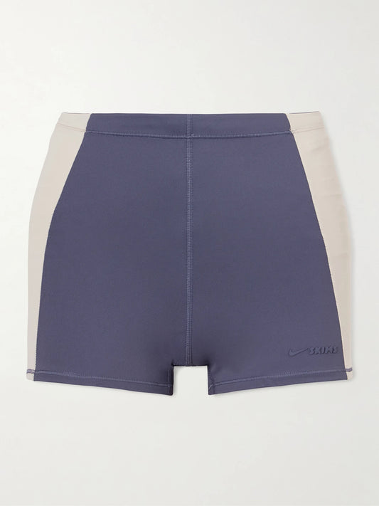 Image of a model wearing Shorts. Product name - + Nike 2" Biker Shorts - Deep Royal And Stone in Blue colour by brand - SKIMS