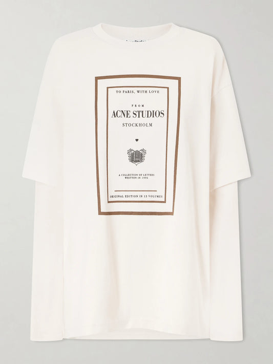 Image of a model wearing Tops. Product name - Edra Double Book Cover Printed Cotton-jersey T-shirt in Beige colour by brand - Acne Studios