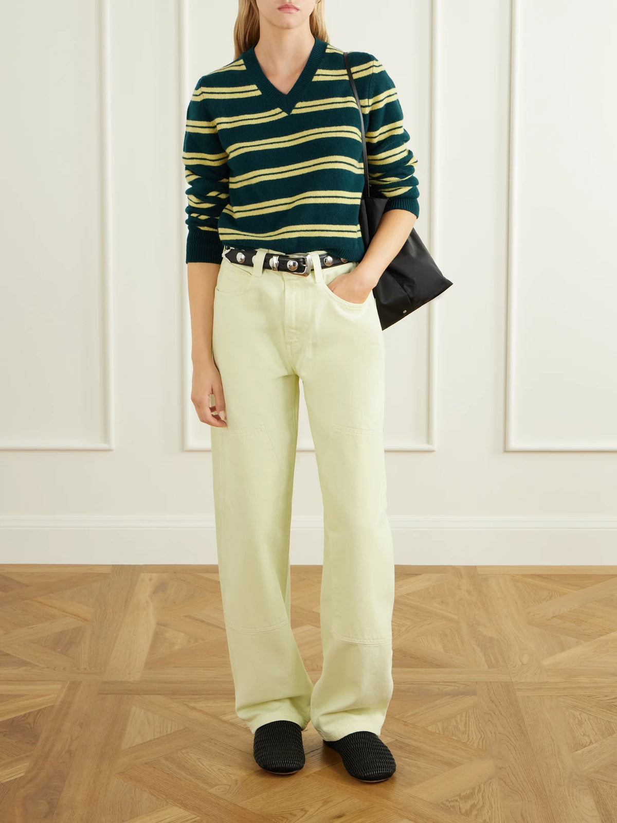Image of a model wearing Outerwear. Product name - Sligo Striped Wool Sweater in Emerald colour by brand - &Daughter