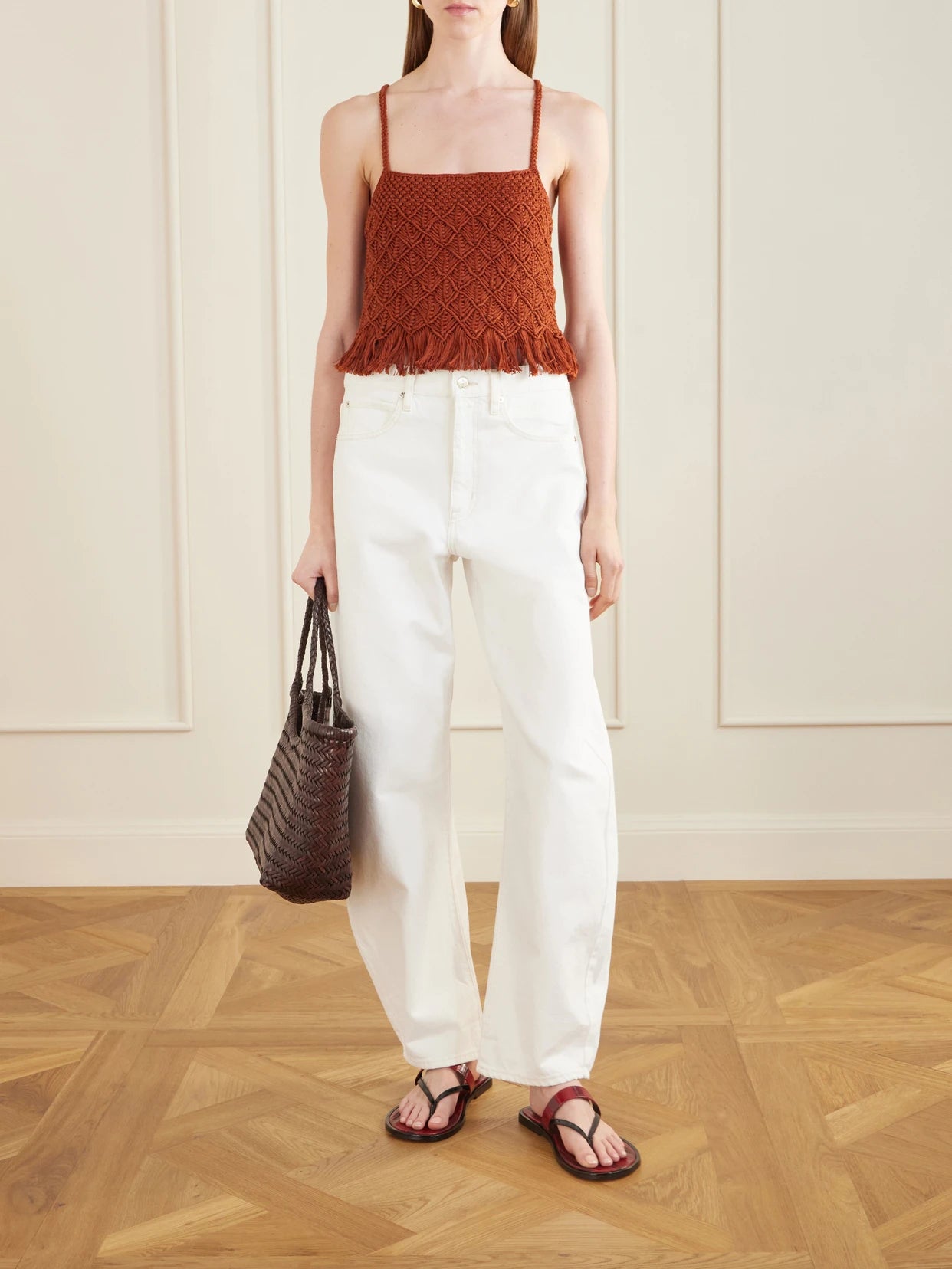 Image of a model wearing Tops. Product name - Cantor Fringed Macramè Cotton Top in Brown colour by brand - ESCVDO