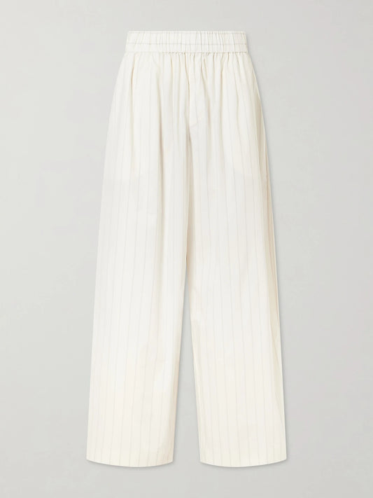 Image of a model wearing Pants. Product name - Everyday Striped Cotton-blend Poplin Wide-leg Pants in Ecru colour by brand - ST. AGNI