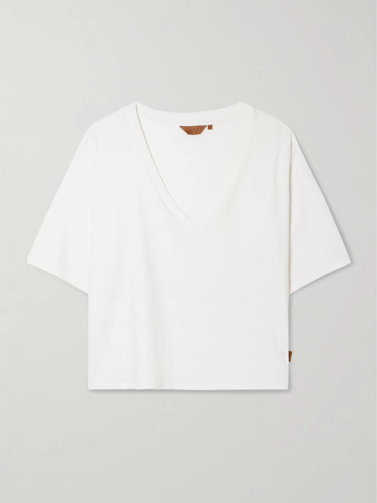 Image of a model wearing Tops. Product name - The V Tee Oversized Cotton-jersey T-shirt in White colour by brand - Jamie Haller