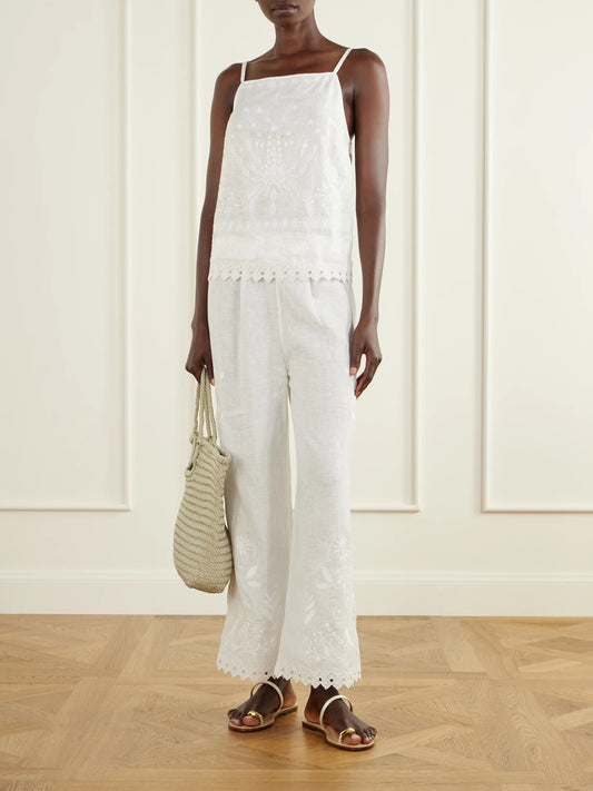 Image of a model wearing Tops. Product name - Corail Embroidered Linen Tank in White colour by brand - Eres
