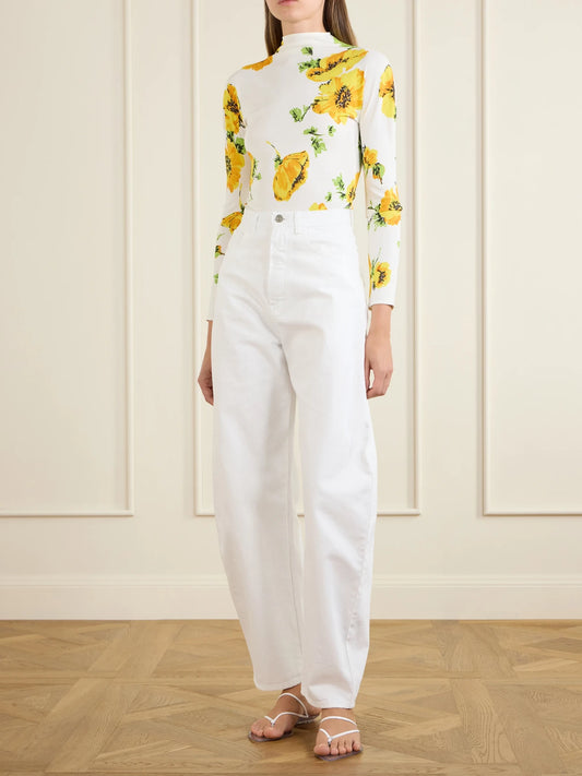 Image of a model wearing Tops. Product name - Floral-print Jersey Bodysuit in White colour by brand - Alaïa
