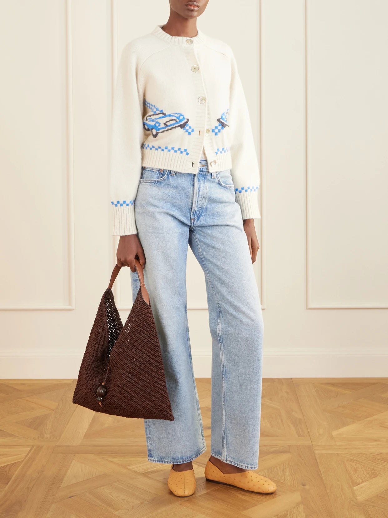 Image of a model wearing Outerwear. Product name - Embroidered Cashmere Cardigan in Cream colour by brand - Calle Del Mar