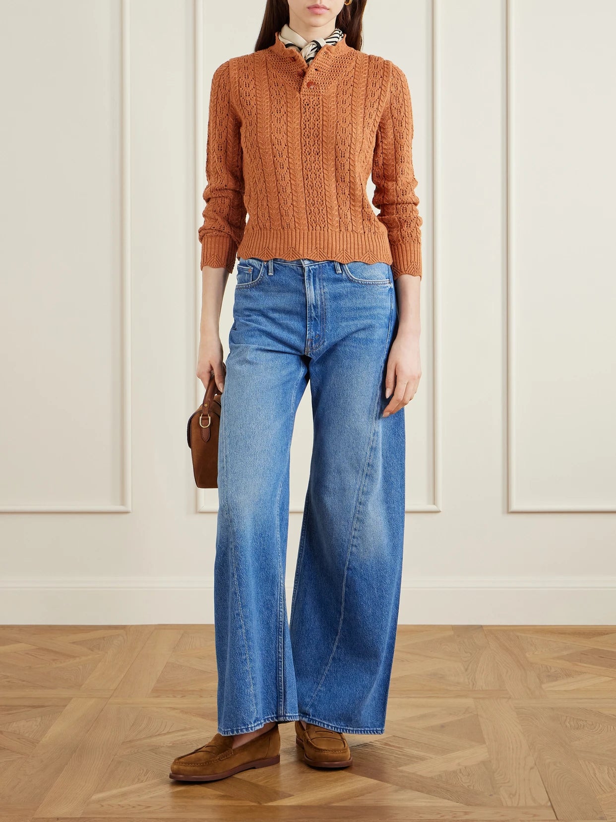 Image of a model wearing Outerwear. Product name - Hannah Crocheted Cotton Sweater in Orange colour by brand - RRL