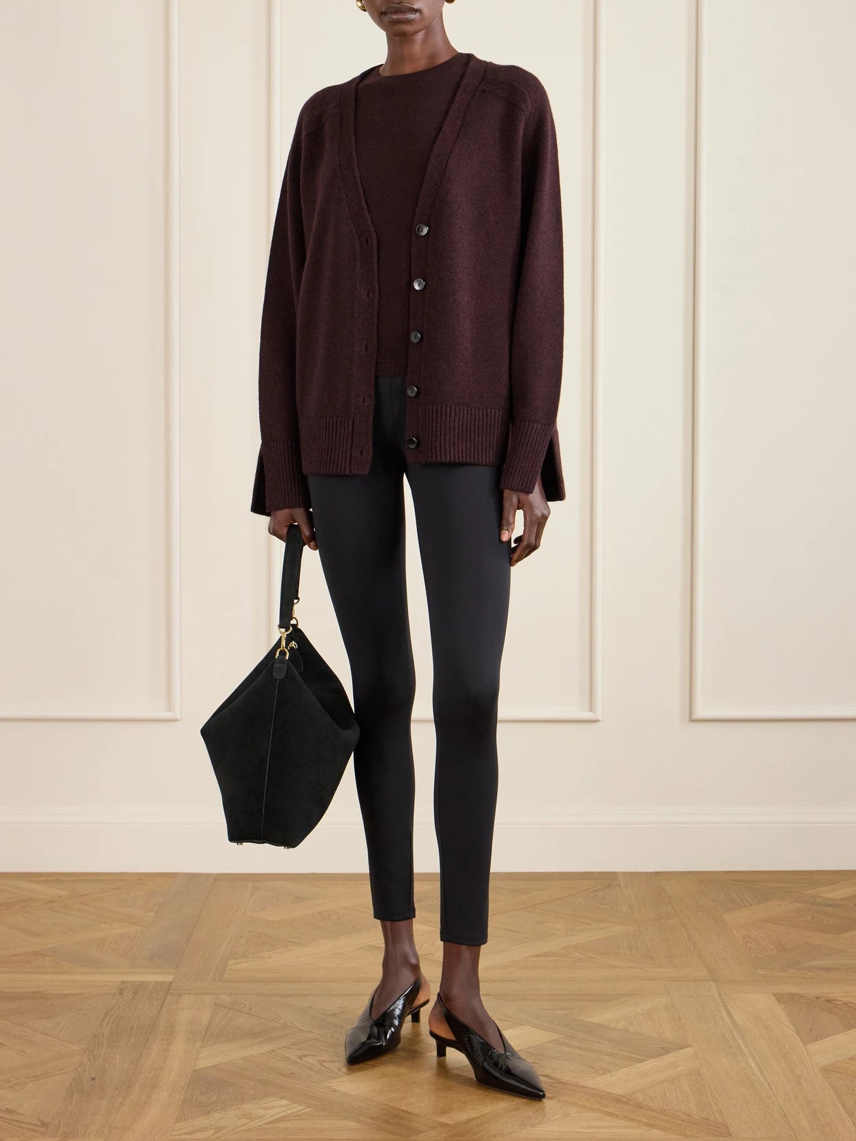 Image of a model wearing Pants. Product name - Stretch-jersey Leggings in Black colour by brand - Maria McManus
