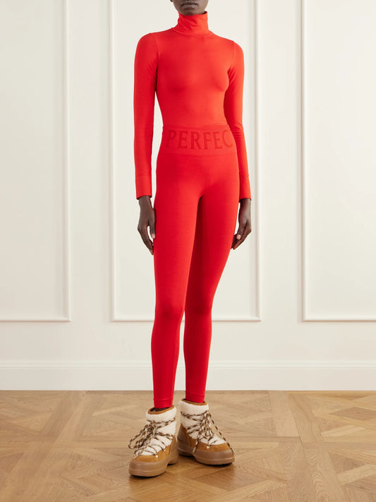 Image of a model wearing Tops. Product name - Ribbed Thermal Modal-blend Turtleneck Base Layer in Red, Burgundy colour by brand - Perfect Moment