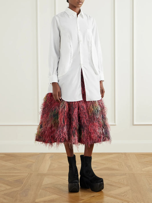 Image of a model wearing Tops. Product name - Paneled Frayed Poplin Shirt in White colour by brand - Comme des Garçons Comme des Garçons
