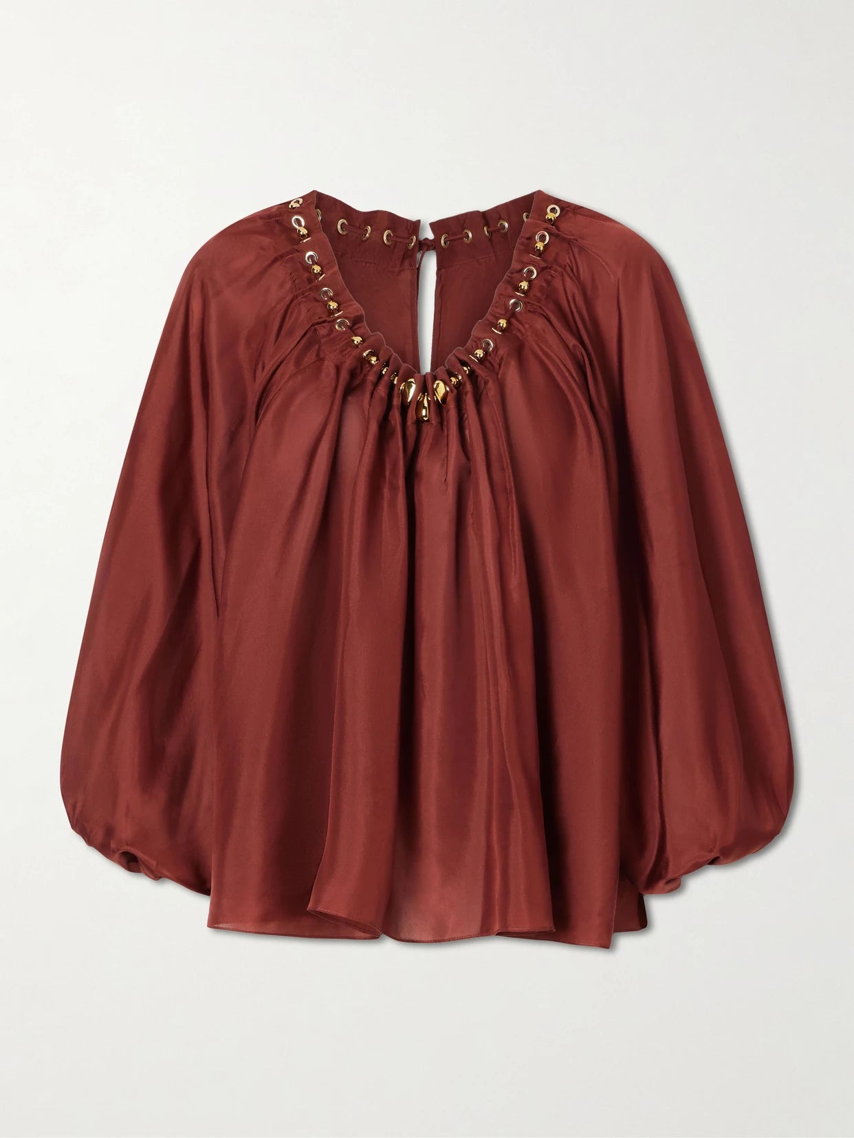 Image of a model wearing Tops. Product name - Aster Gathered Beaded Silk-satin Blouse in Burgundy colour by brand - Zimmermann
