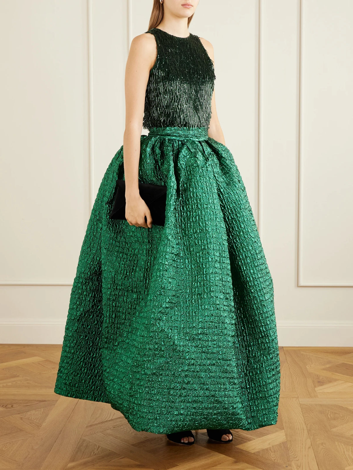 Image of a model wearing Tops. Product name - Sequin-embellished Jersey Blouse in Dark green colour by brand - Dima Ayad