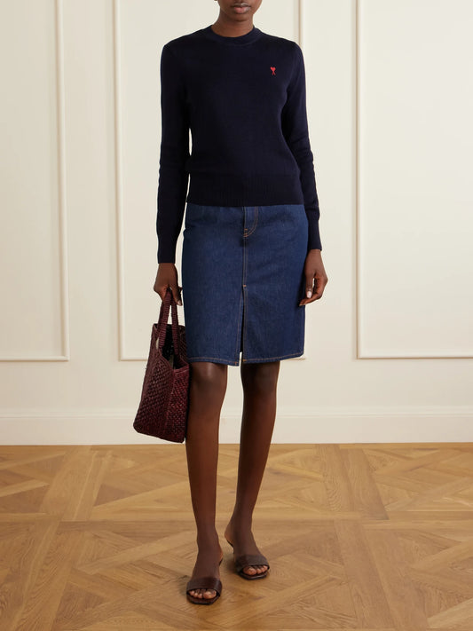 Image of a model wearing Outerwear. Product name - Adc Embroidered Merino Wool Sweater in Navy colour by brand - AMI PARIS