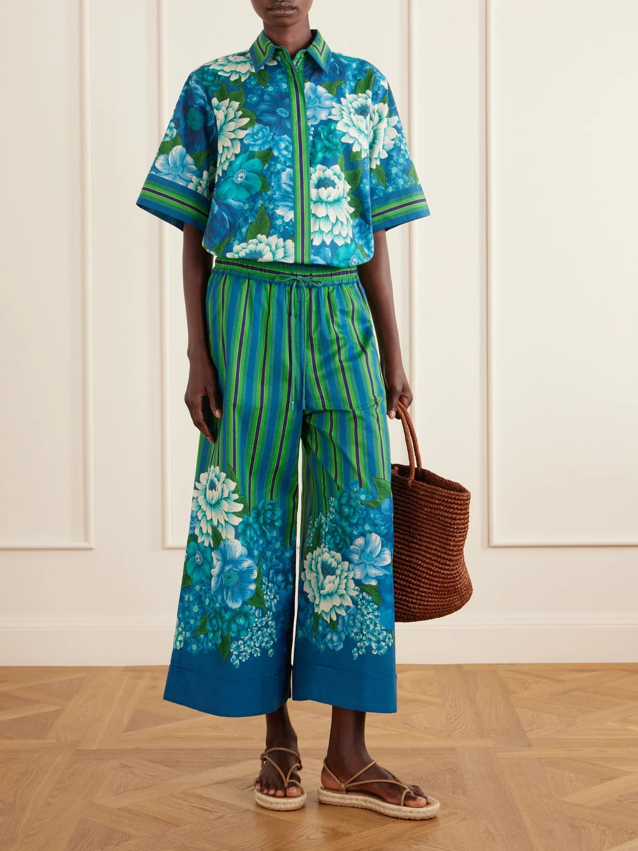 Image of a model wearing Pants. Product name - Margo Printed Organic Cotton-voile Wide-leg Pants in Multi colour by brand - ALÉMAIS