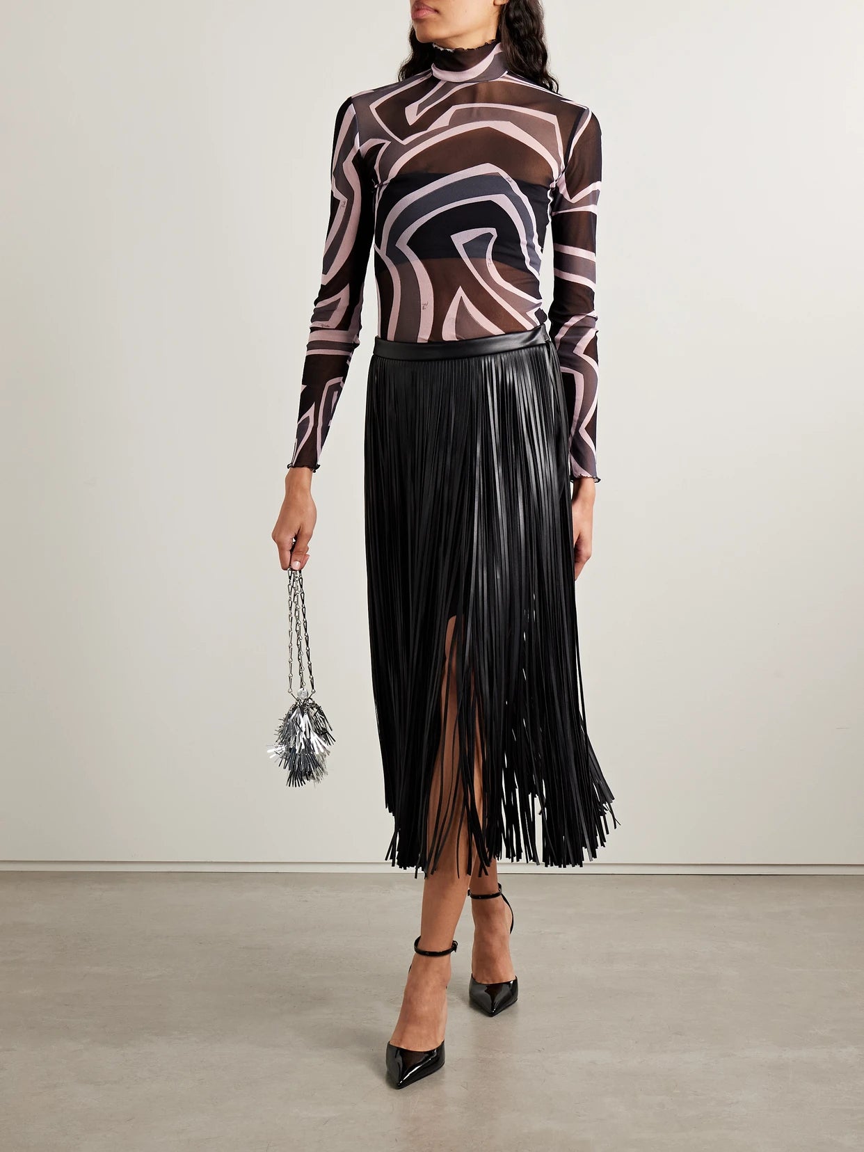 Image of a model wearing Tops. Product name - Printed Tulle Turtleneck Top in Multi colour by brand - PUCCI