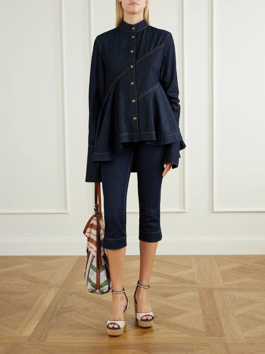 Image of a model wearing Tops. Product name - Asymmetric Denim Shirt in Navy colour by brand - Zimmermann