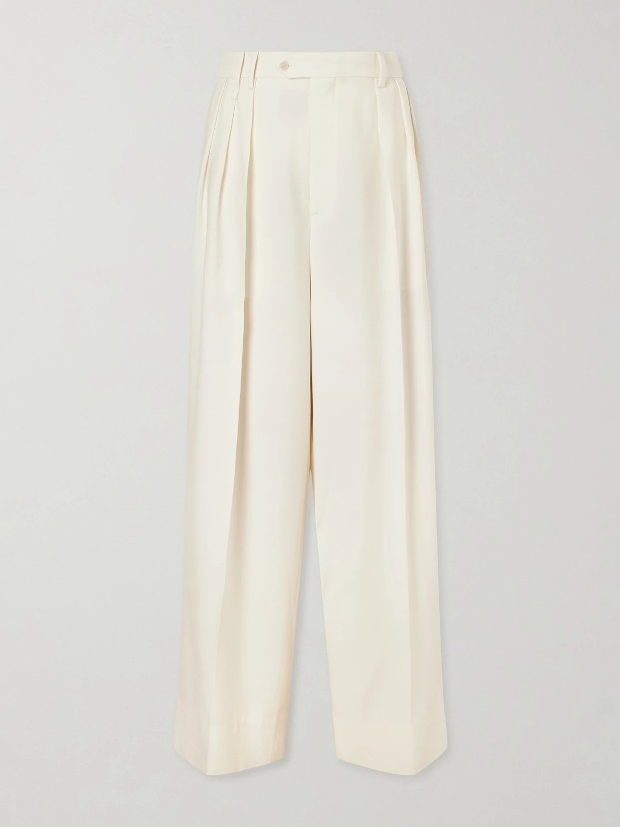 Image of a model wearing Pants. Product name - Alexandra Pleated Grain De Poudre Wool Wide-leg Pants in Ivory colour by brand - Calvin Klein Collection