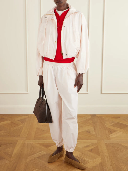 Image of a model wearing Pants. Product name - Forbes Organic Cotton-poplin Balloon Pants in Pastel pink colour by brand - RÙADH