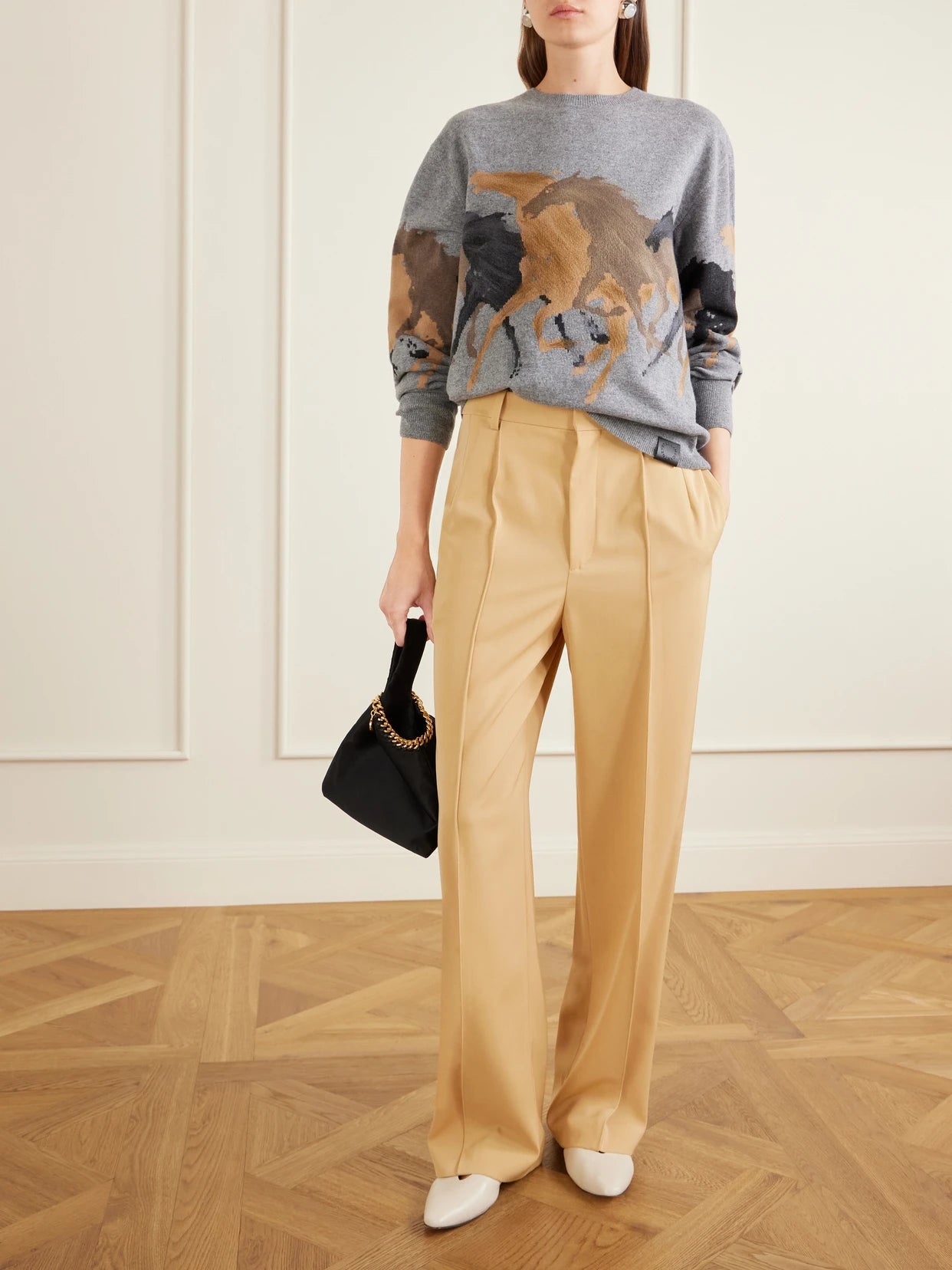 Image of a model wearing Outerwear. Product name - Racing Horse Wool Sweater in Grape colour by brand - Stella McCartney