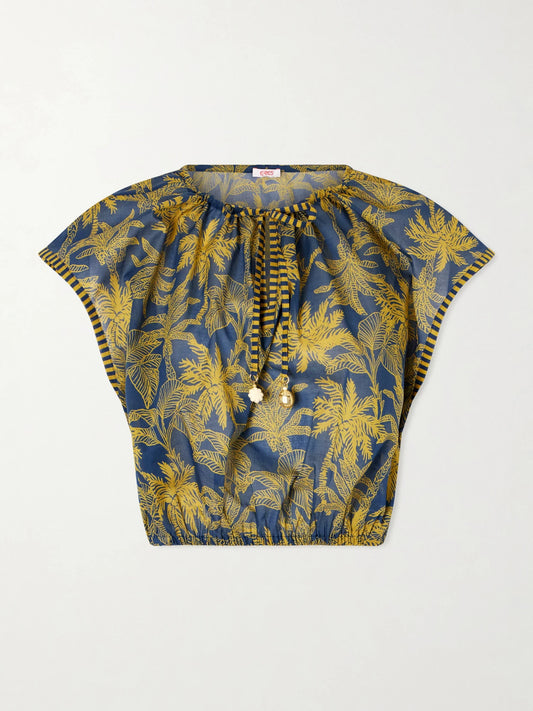 Image of a model wearing Tops. Product name - Crocodile Embellished Printed Cotton-voile Blouse in Navy colour by brand - Eres