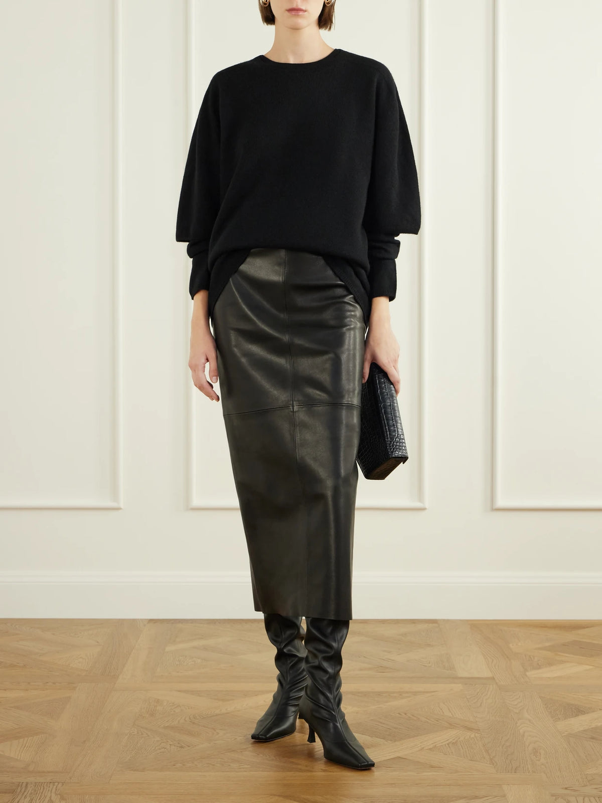 Image of a model wearing Outerwear. Product name - Cobain Layered Cashmere Sweater in Black colour by brand - Nour Hammour