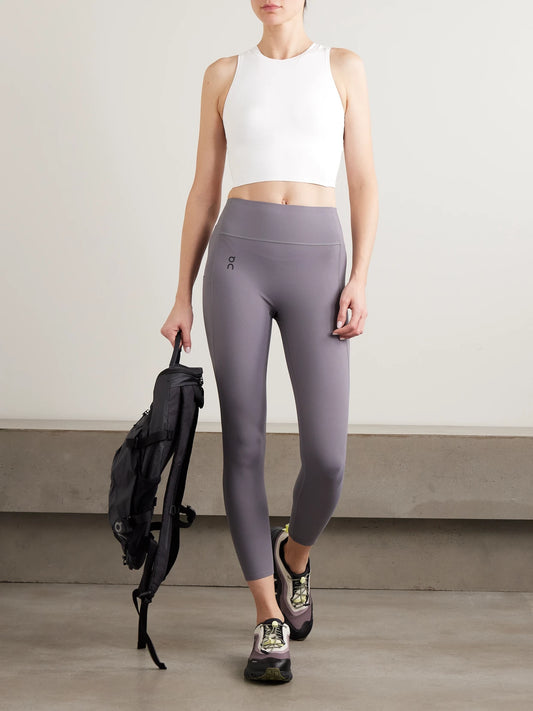 Image of a model wearing Tops. Product name - Studio Cropped Stretch Top in White colour by brand - ON
