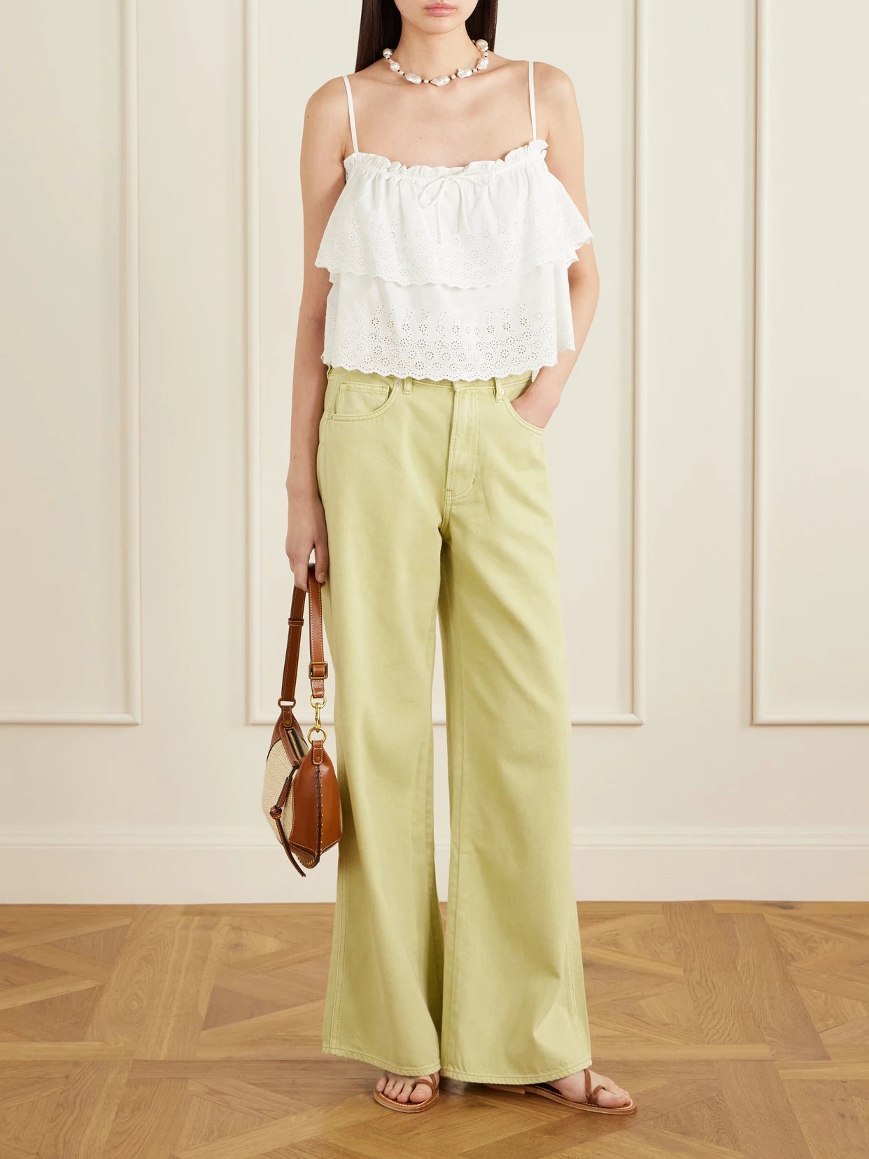 Image of a model wearing Tops. Product name - Oseanna Ruffled Broderie Anglaise Cotton Top in White colour by brand - Veronica Beard
