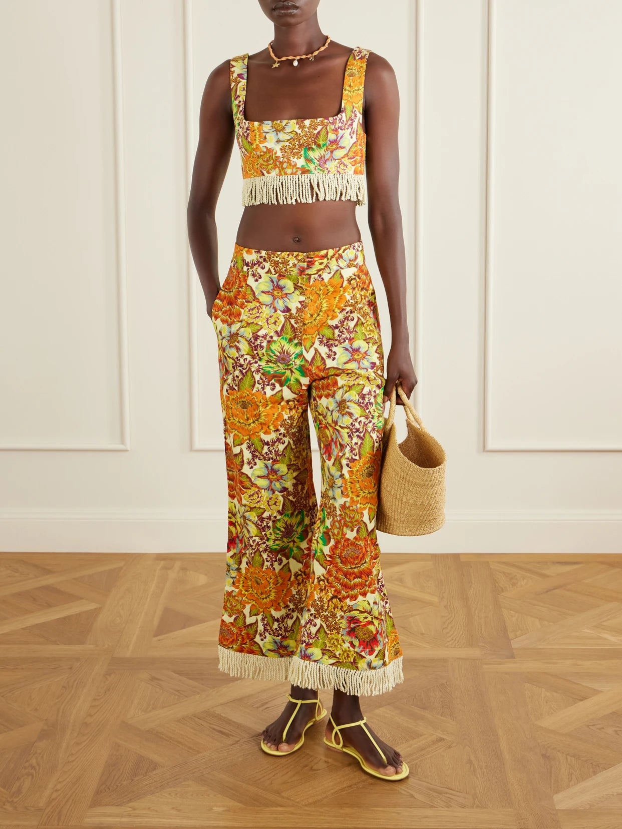 Image of a model wearing Tops. Product name - Fringed Cropped Floral-print Linen Top in Multi colour by brand - ALÉMAIS