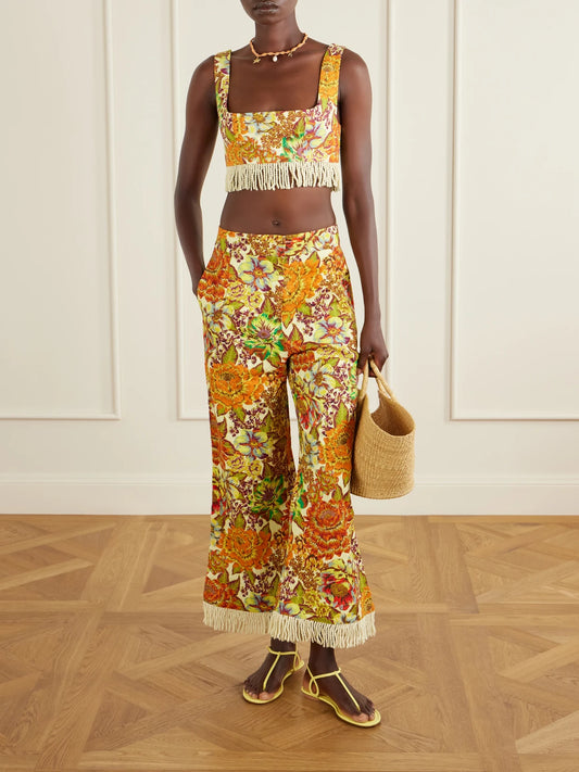 Image of a model wearing Tops. Product name - Fringed Cropped Floral-print Linen Top in Multi colour by brand - ALÉMAIS