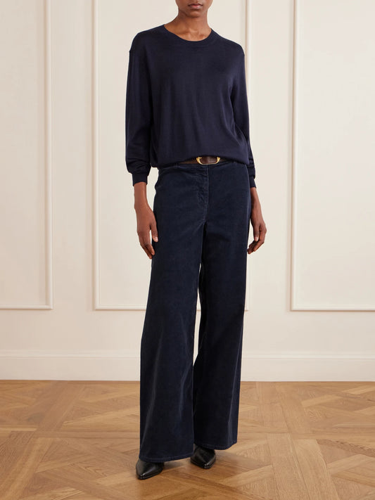 Image of a model wearing Pants. Product name - Megan Cotton-blend Corduroy Wide-leg Pants in Blue, Brown, Sand colour by brand - Nili Lotan