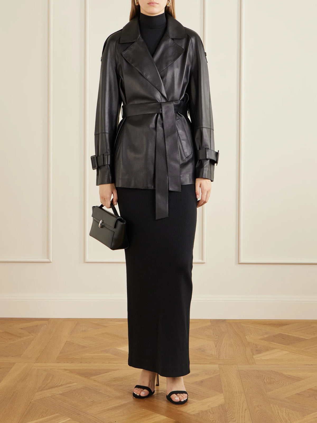 Image of Coats & Jackets. Product name - Nera Belted Leather Jacket in Black colour by brand - Nour Hammour