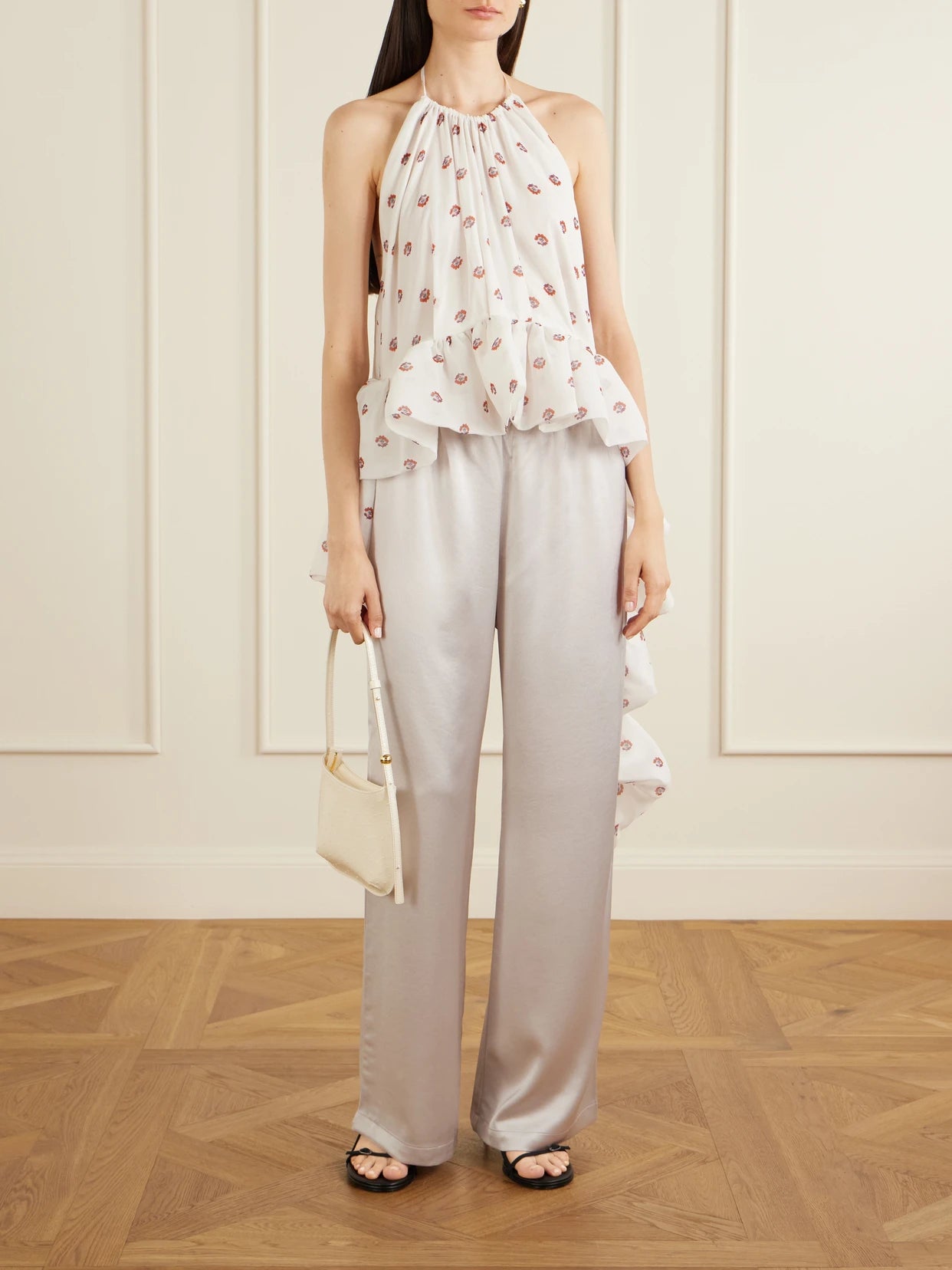 Image of a model wearing Tops. Product name - Tamara Silk-chiffon Peplum Blouse in White colour by brand - LIBEROWE